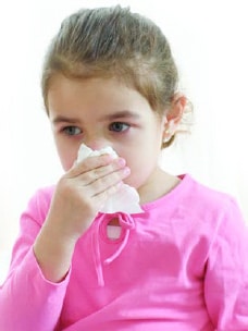 a little girl in a pink shirt