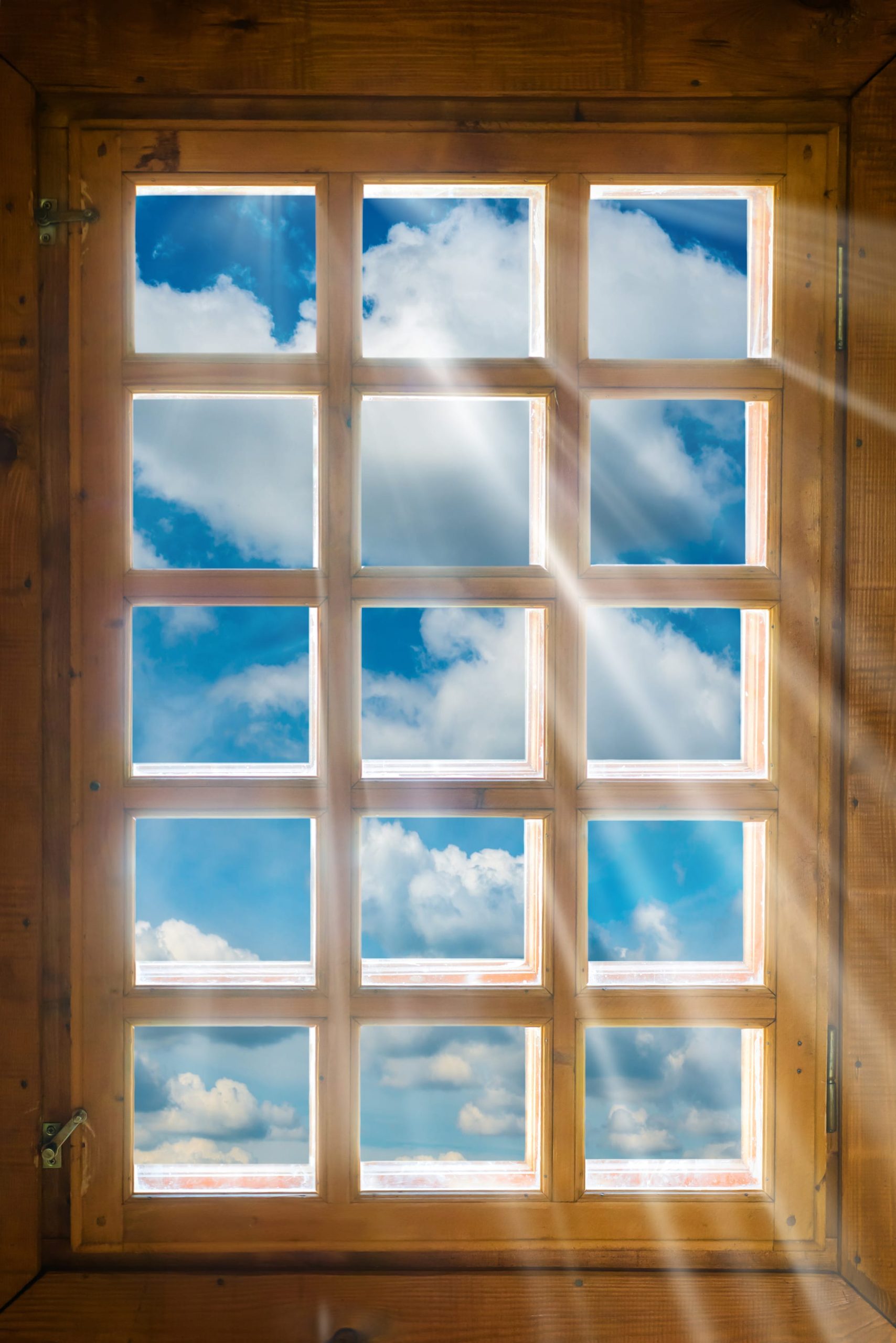 a room with wooden floors and a large window