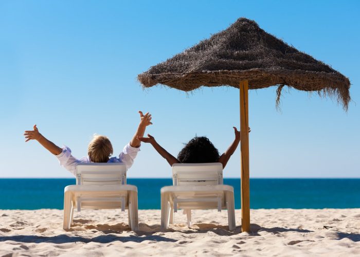 A Person Sitting At A Beach