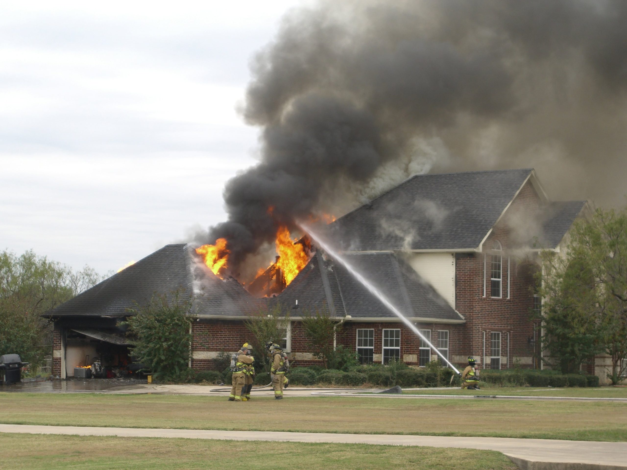 a house with smoke and fire