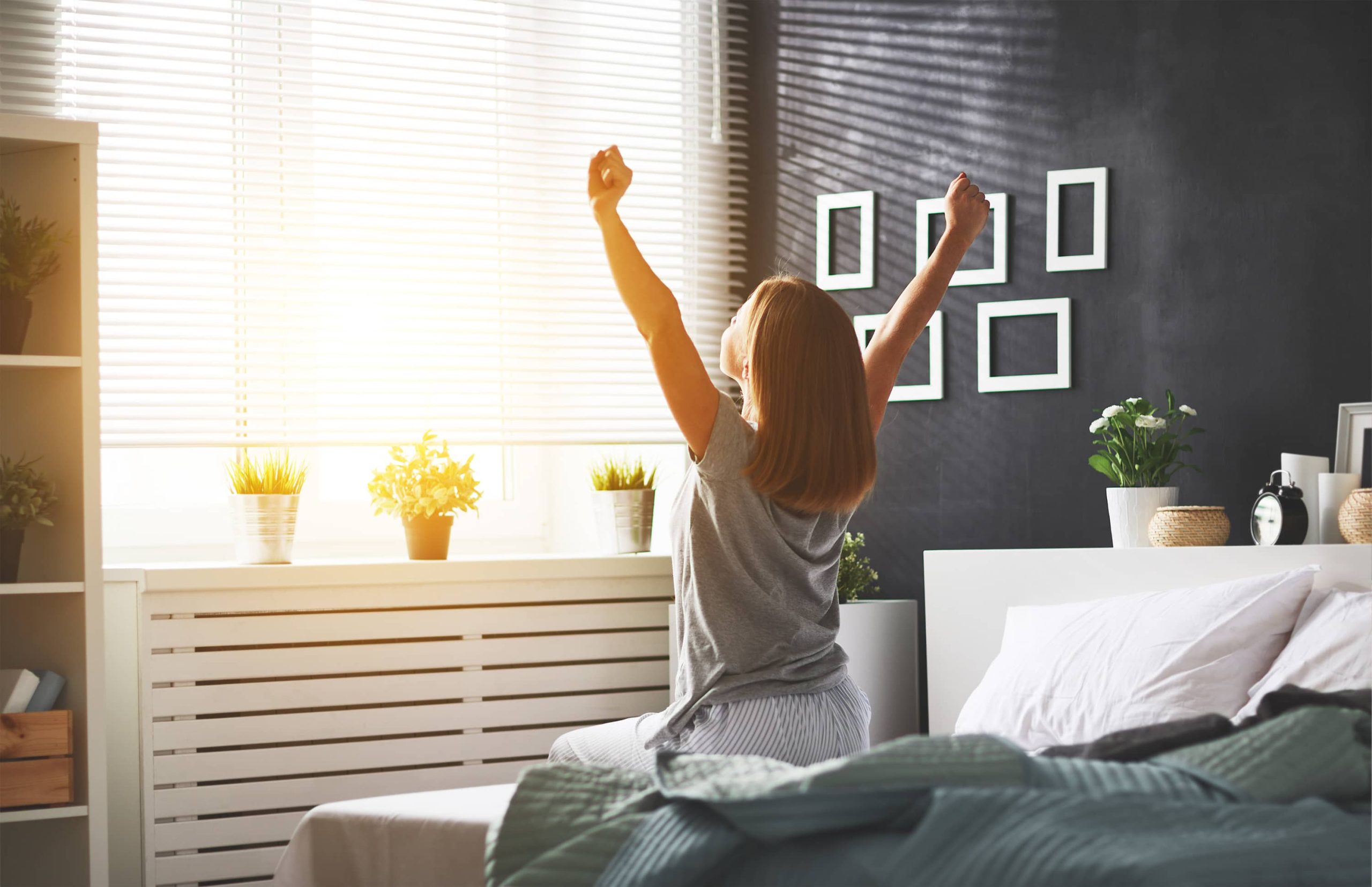 a woman sitting on a bed