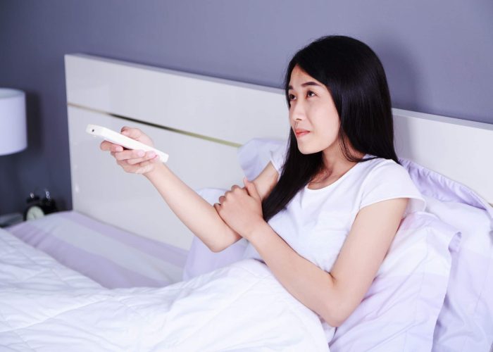 A Woman Lying On A Bed
