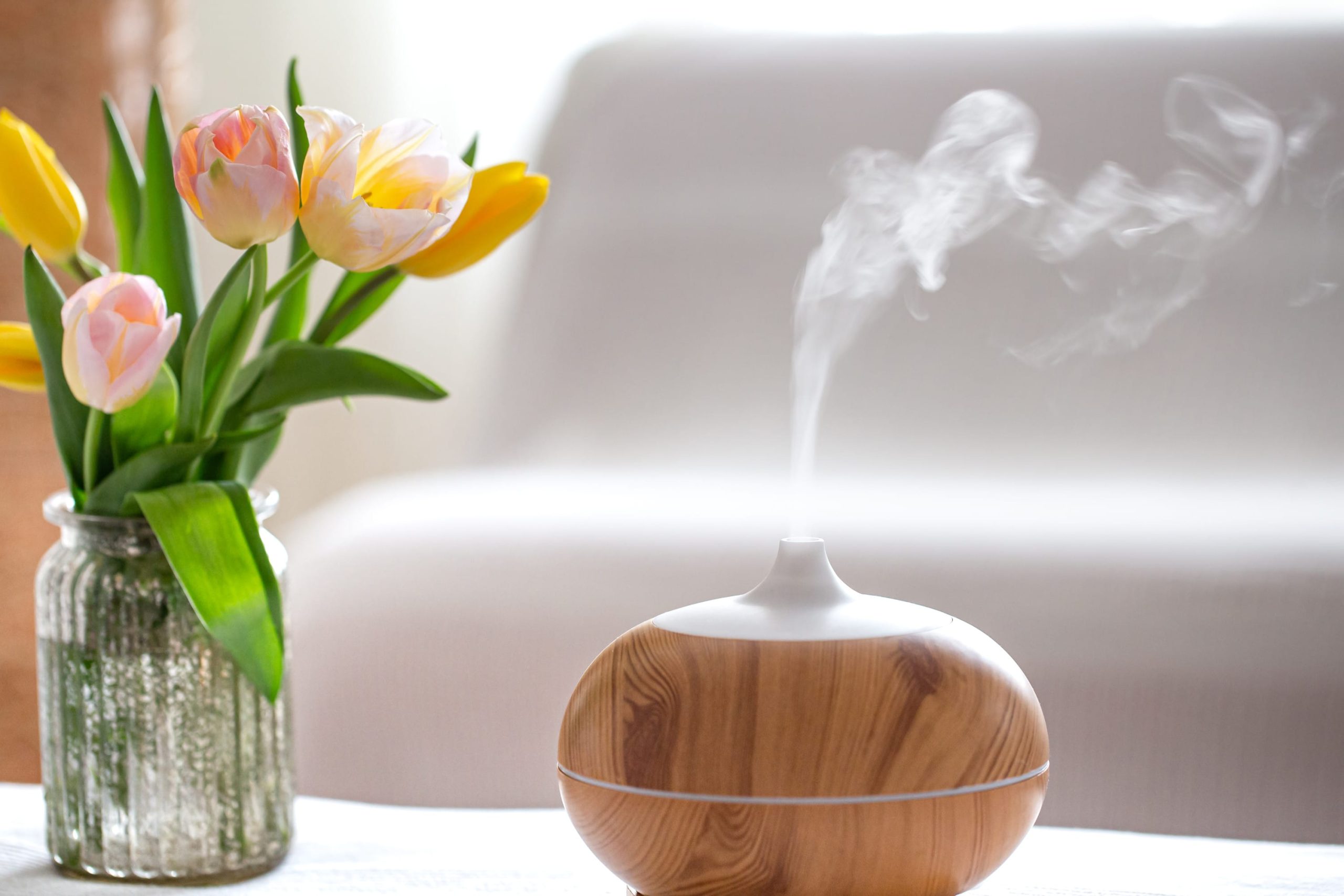 a vase filled with flowers sitting on a table